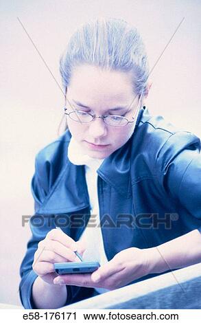 Woman and palm pilot View Large Photo Image Stock Image - Woman and palm pilot. Fotosearch