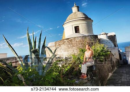 Woman and Stromboli church, Sicily, Italy View Large Photo Image Picture - Woman and Stromboli church, Sicily, Italy. Fotosearch