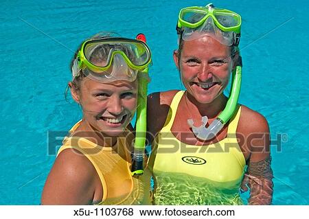woman and teenage snorkellers in hotel swimming pool View Large Photo Image Stock Photo - woman and teenage snorkellers in hotel swimming pool. Fotosearch