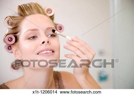 Woman applying eyeshadow. View Large Photo Image Picture - Woman applying eyeshadow.. Fotosearch
