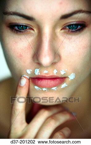 Woman applying facial cream View Large Photo Image Stock Image - Woman applying facial cream. Fotosearch