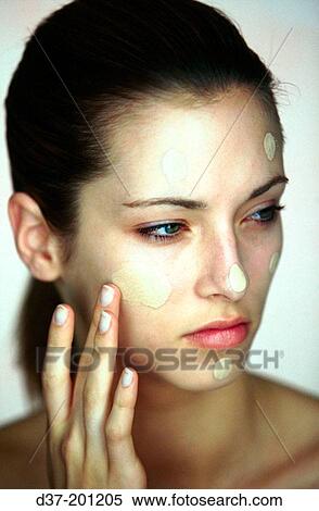 Woman applying facial cream View Large Photo Image Stock Photography - Woman applying facial cream. Fotosearch