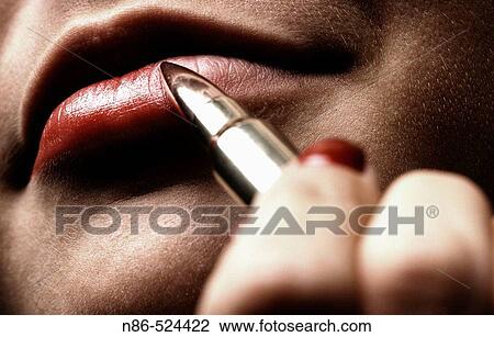 Woman applying lipstick with bullet, conceptual View Large Photo Image Stock Image - Woman applying lipstick with bullet, conceptual. Fotosearch