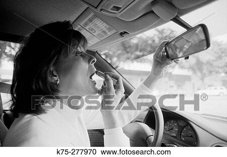 woman applying make-up in car View Large Photo Image Stock Image - woman applying make-up in car. Fotosearch