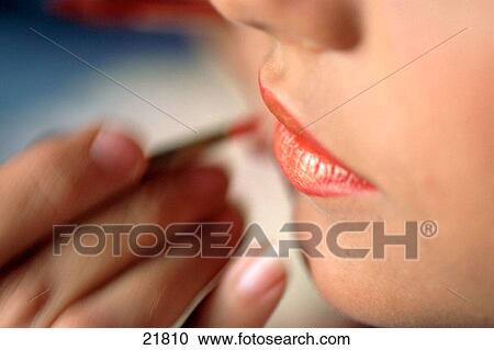 Woman applying make up on lips View Large Photo Image Stock Image - Woman applying make up on lips. Fotosearch