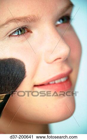 Woman applying make-up View Large Photo Image Stock Image - Woman applying make-up. Fotosearch