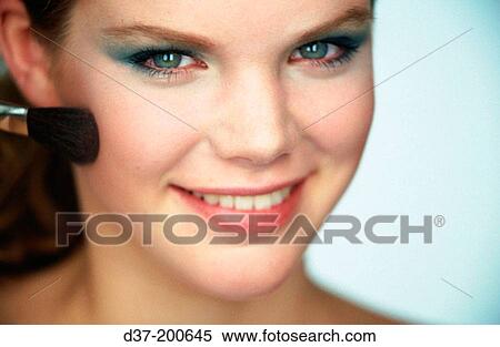Woman applying make-up View Large Photo Image Stock Photography - Woman applying make-up. Fotosearch