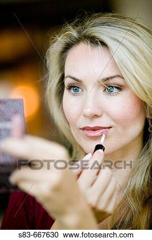 Woman applying makup View Large Photo Image Stock Image - Woman applying makup. Fotosearch