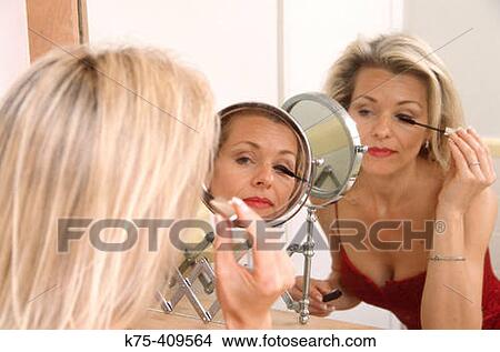 Woman applying mascara View Large Photo Image Picture - Woman applying mascara. Fotosearch