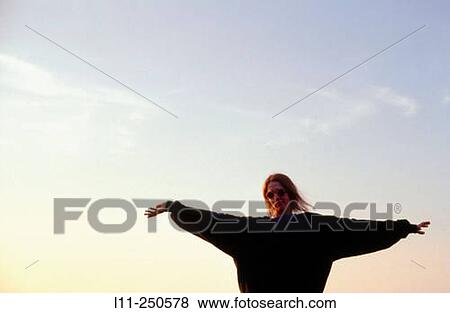 Stock Photo - Woman, arms outstretched. Fotosearch
