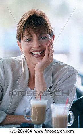 woman at a cafe View Large Photo Image Picture - woman at a cafe. Fotosearch