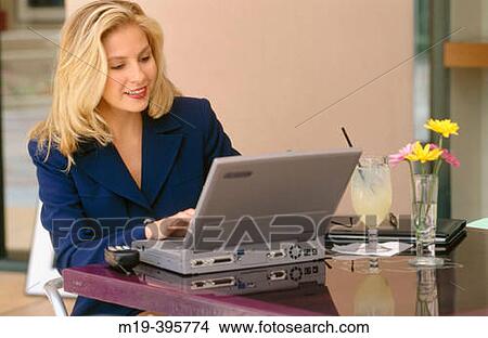 woman at a cafe with a computer View Large Photo Image Picture - woman at a cafe with a computer. Fotosearch