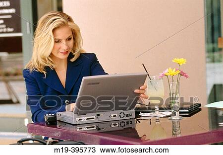 woman at a cafe with a computer View Large Photo Image Stock Image - woman at a cafe with a computer. Fotosearch