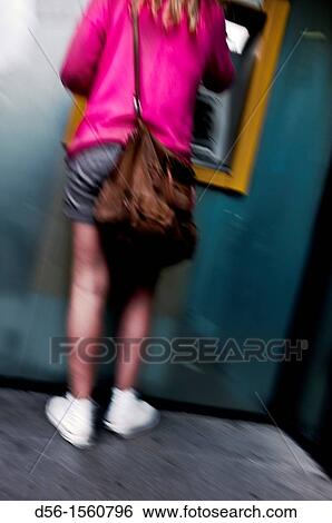 woman at a cash dispenser View Large Photo Image Stock Photograph - woman at a cash dispenser. Fotosearch