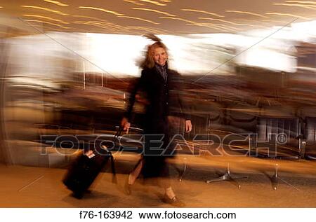 Woman at airport View Large Photo Image Stock Image - Woman at airport. Fotosearch