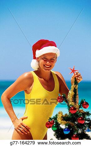 Stock Photo - Woman at beach in Christmas. Dominican Republic. Fotosearch
