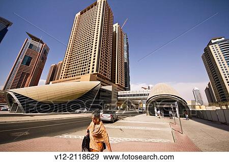 Woman at Dubai Internet city, Metro Station, Dubai, United Arab Emirates, Middle East View Large Photo Image Stock Photo - Woman at Dubai Internet city, Metro Station, Dubai, United Arab Emirates, Middle East. Fotosearch