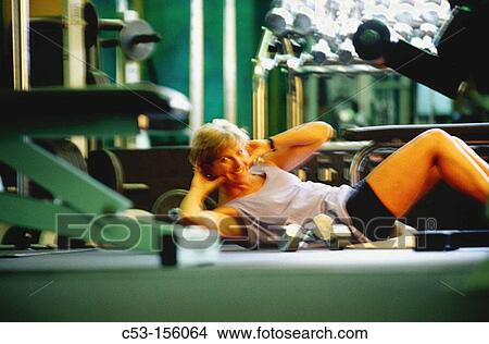 Woman at gym View Large Photo Image Picture - Woman at gym. Fotosearch