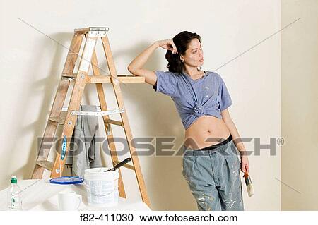 Woman at home painting View Large Photo Image Stock Image - Woman at home painting. Fotosearch