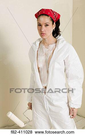 Stock Photo - Woman at home painting. Fotosearch