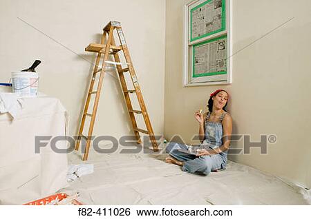 Woman at home painting View Large Photo Image Stock Photograph - Woman at home painting. Fotosearch