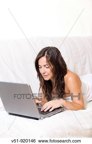 Woman at home with laptop View Large Photo Image Stock Photograph - Woman at home with laptop. Fotosearch
