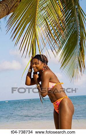 Picture - Woman at Las Terrenas beach, Dominican Republic. Fotosearch