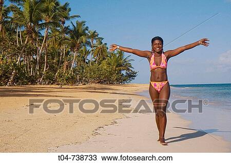 Stock Image - Woman at Las Terrenas beach, Dominican Republic. Fotosearch