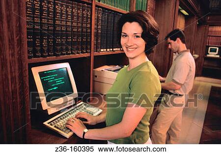 Stock Photography - Woman at library. Fotosearch