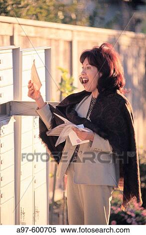 Woman at mailbox View Large Photo Image Stock Photography - Woman at mailbox. Fotosearch