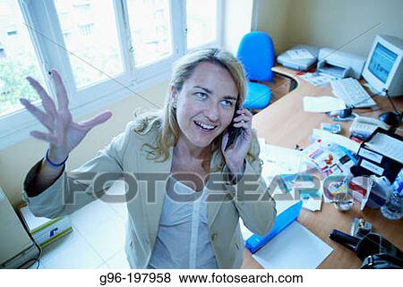 Woman at the office View Large Photo Image Stock Photo - Woman at the office. Fotosearch