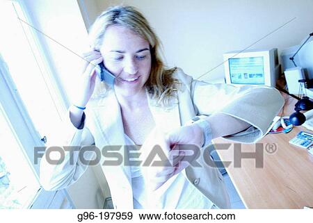 Stock Photo - Woman at the office. Fotosearch