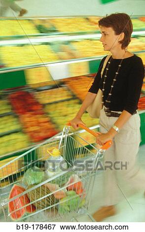 Woman at the supermarket View Large Photo Image Stock Photo - Woman at the supermarket. Fotosearch
