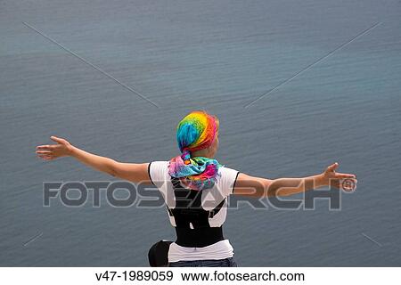 woman at the top of the Rock of Ifach with gesture of freedom, Calpe, Alicante, Spain. View Large Photo Image Stock Photo - woman at the top of the Rock of Ifach with gesture of freedom, Calpe, Alicante, Spain.. Fotosearch