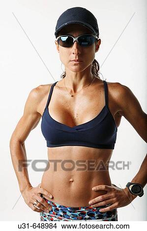 Woman athlete poses in studio View Large Photo Image Picture - Woman athlete poses in studio. Fotosearch