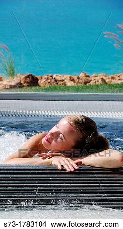 Woman bathing in jacuzzi of spa center View Large Photo Image Picture - Woman bathing in jacuzzi of spa center. Fotosearch
