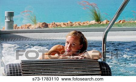 Woman bathing in jacuzzi of spa center View Large Photo Image Stock Image - Woman bathing in jacuzzi of spa center. Fotosearch
