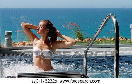 Woman bathing in jacuzzi of spa center View Large Photo Image Stock Photography - Woman bathing in jacuzzi of spa center. Fotosearch