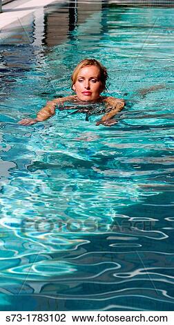 Woman bathing in swimming pool of spa center View Large Photo Image Stock Image - Woman bathing in swimming pool of spa center. Fotosearch