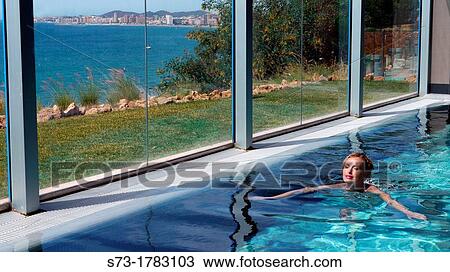 Woman bathing in swimming pool of spa center View Large Photo Image Stock Image - Woman bathing in swimming pool of spa center. Fotosearch