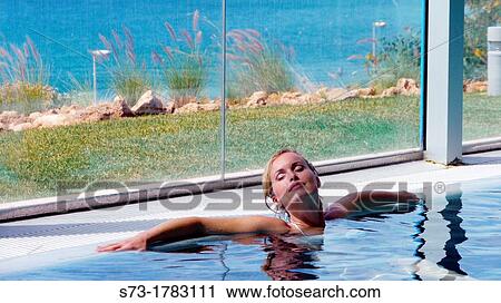 Woman bathing in swimming pool of spa center View Large Photo Image Stock Image - Woman bathing in swimming pool of spa center. Fotosearch