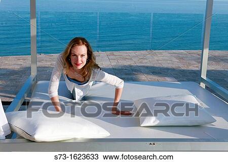 Stock Image - Woman beach relaxing. Fotosearch
