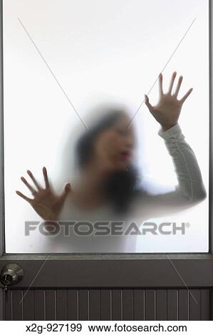 Woman behind a frosted glass door View Large Photo Image Stock Photo - Woman behind a frosted glass door. Fotosearch