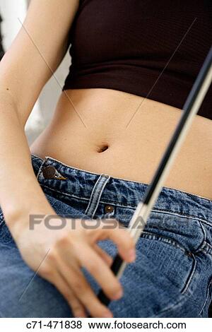 Woman belly button with violin bow View Large Photo Image Stock Photo - Woman belly button with violin bow. Fotosearch