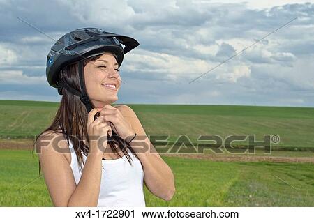 Woman biker enjoy in the ruralscape with her helmet Aragon, Spain View Large Photo Image Stock Image - Woman biker enjoy in the ruralscape with her helmet Aragon, Spain. Fotosearch