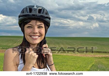 Woman biker enjoy in the ruralscape with her helmet Aragon, Spain View Large Photo Image Stock Photo - Woman biker enjoy in the ruralscape with her helmet Aragon, Spain. Fotosearch