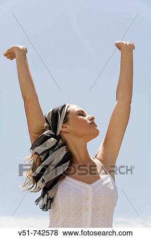 Stock Photo - Woman breathing by the sea. Fotosearch