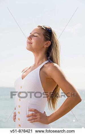 Woman breathing fresh air by the sea View Large Photo Image Stock Image - Woman breathing fresh air by the sea. Fotosearch