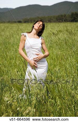 Stock Photograph - Woman breathing fresh air.. Fotosearch