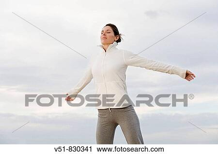 Woman breathing in a cliff by the sea View Large Photo Image Stock Image - Woman breathing in a cliff by the sea. Fotosearch